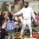 Nipsey Hussle greeting kids at an event to reveal a neighborhood basketball court he had worked to have refurbished, Oct. 22, 2018, in Los Angeles.